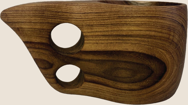 Teak Kuksa coffee mug on sand background