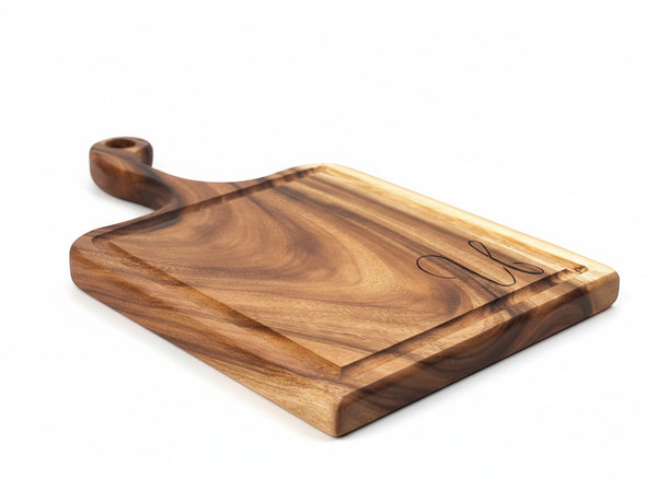 Tuckahoe Hardwoods large live edge East Indian Walnut handled cutting board with engraved monogram